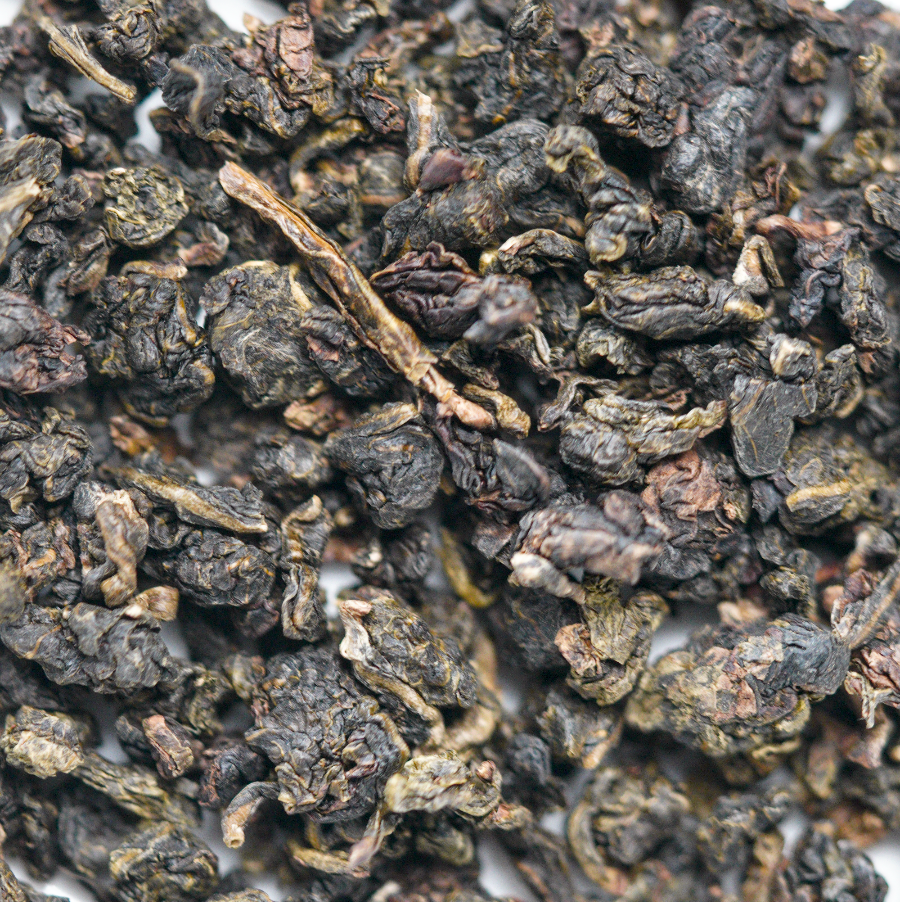 Čajové lístky Wulongu prirodzene prevonané čerstvými kvetmi pomela – Nizu Tea.